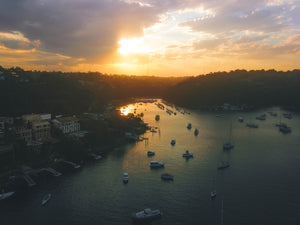 Sunset at Sailors Bay - Luxury houses and sailboats - Taken close to Mowbray Point, Minimbah Road and Clive Park - Stock Photo
